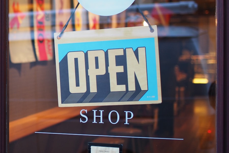 An open sign hanging in a local shop window