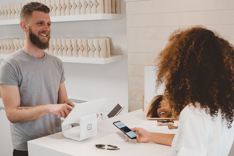 A customer paying by card at a counter